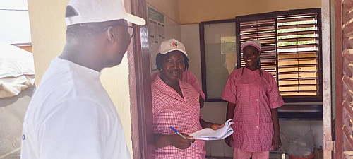 Midwives talking with the project supervisor about event operations.