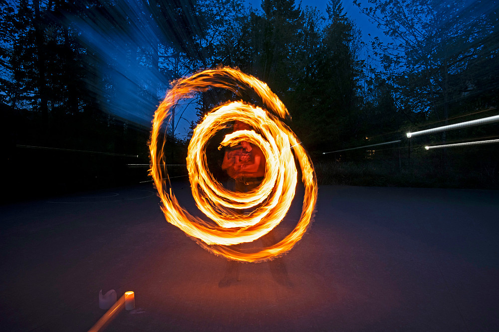 Sri Sundaresan BA '27 creates a mesmerizing arc of fire during a practice session of Fire Arts, one of L&C's 100-plus s...