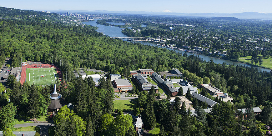 Aerial view of campus taken in 2016 showing the Willamette river and downtown Portland in the background.