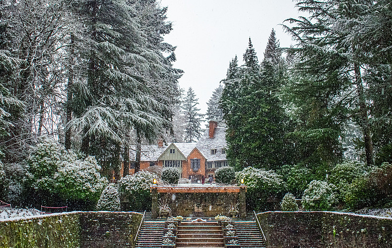 Exterior of Manor House in the snow.