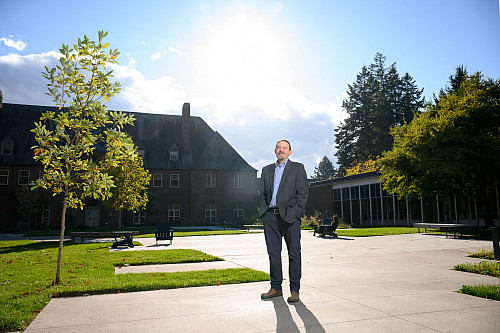 Dean Fletcher stands on the newly built Graduate Commons.