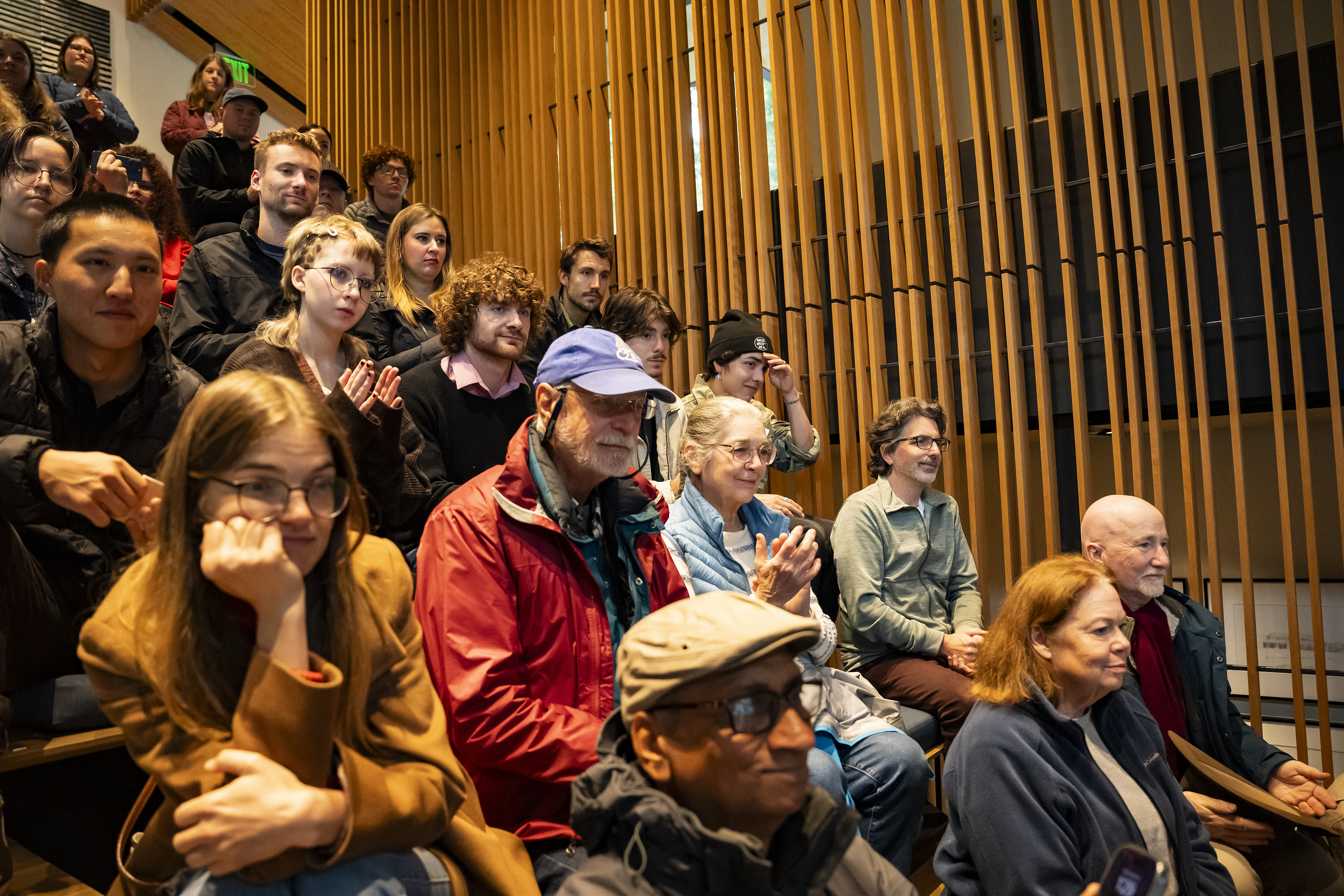 A group of people watching a musical performance.