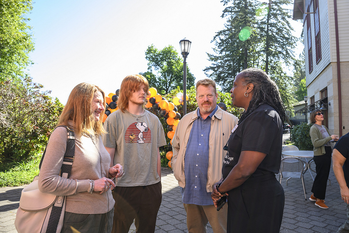 President Robin Holmes-Sullivan (right) connecting with new students and families at New Student Orientation.