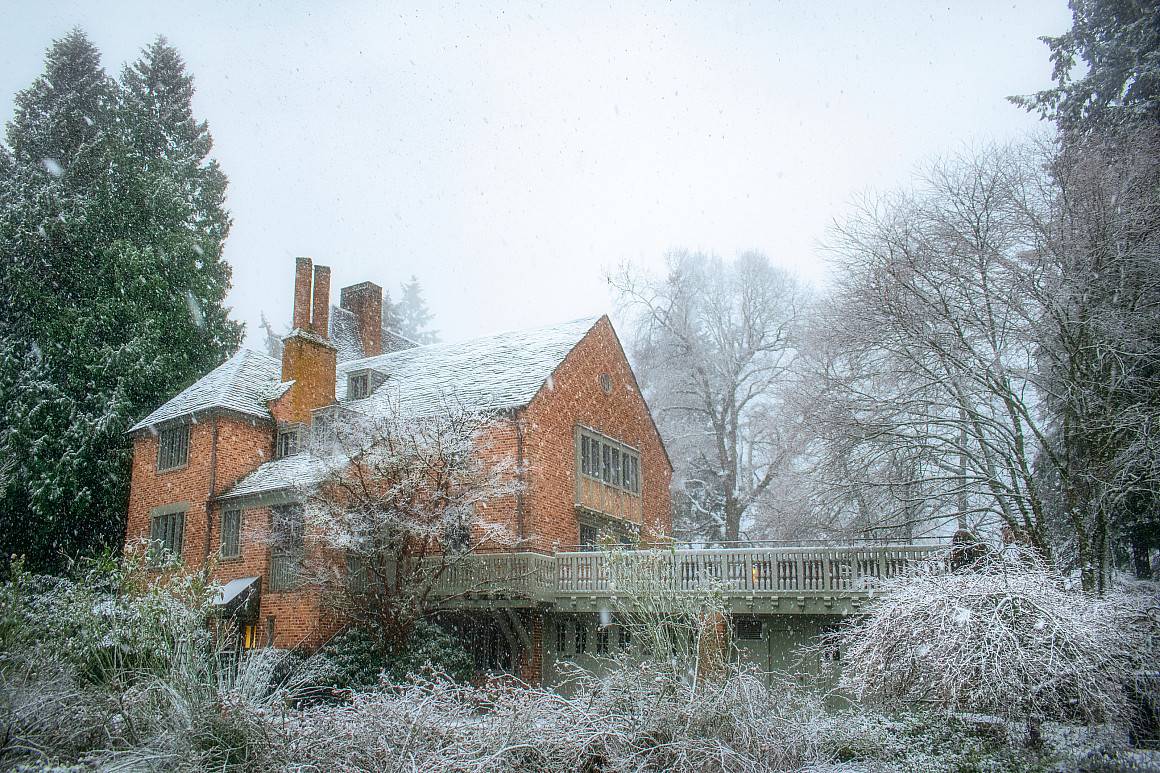 The Manor House with snow and fog.