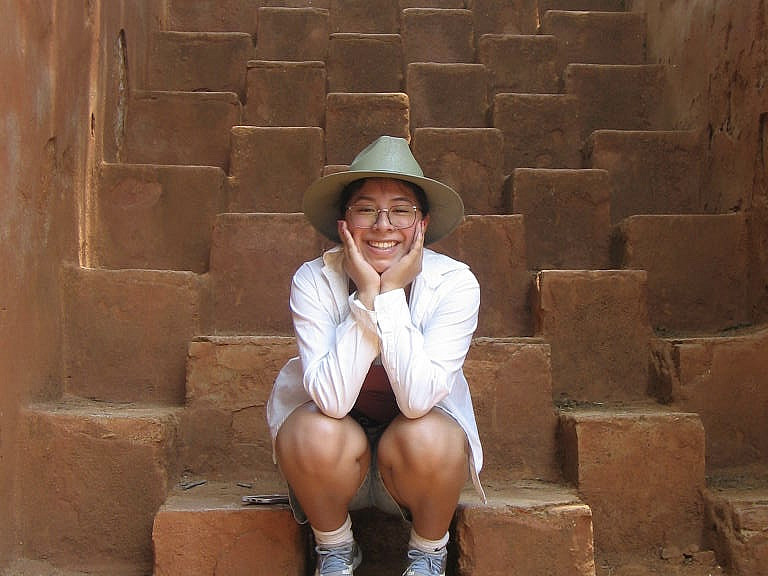 Azucena Morales Santos BA '24 enjoys a break on the steps of a historical site in Oaxaca.